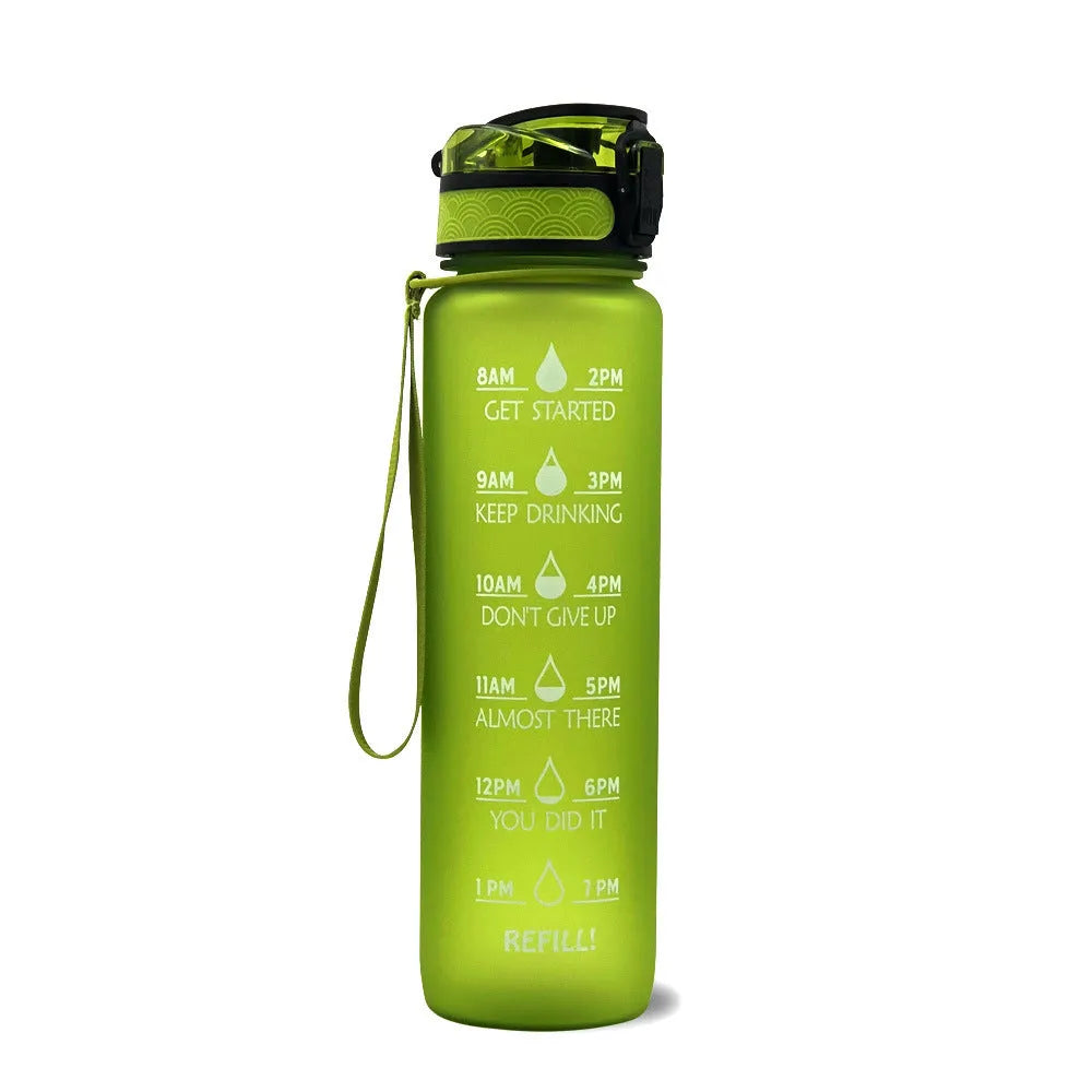 Blue and red gradient 1-litre Tritan sports water bottle with time markers, flip-top lid, and wrist strap.