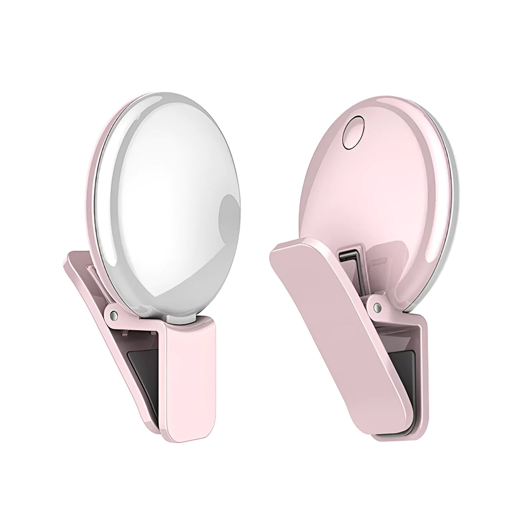 Round white mobile phone fill light clipped onto a smartphone for selfies.