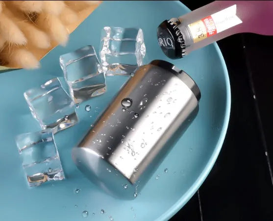 Stainless steel automatic bottle opener showing one-handed operation on beer bottle