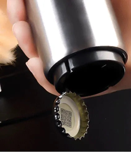 Stainless steel automatic bottle opener showing one-handed operation on beer bottle