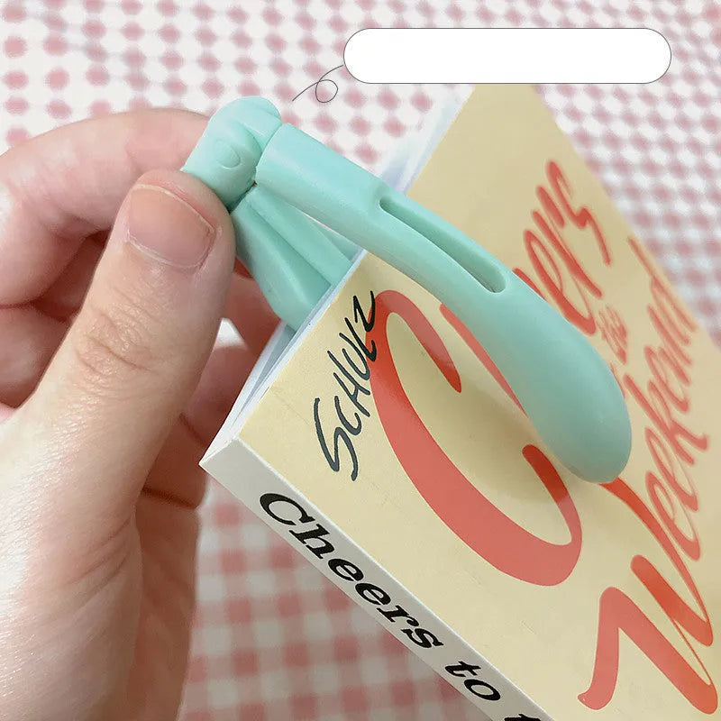 Folding book light in blue colour showing portable battery-powered design