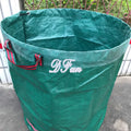 Green polypropylene garden leaf bag for collecting fallen leaves and garden waste.