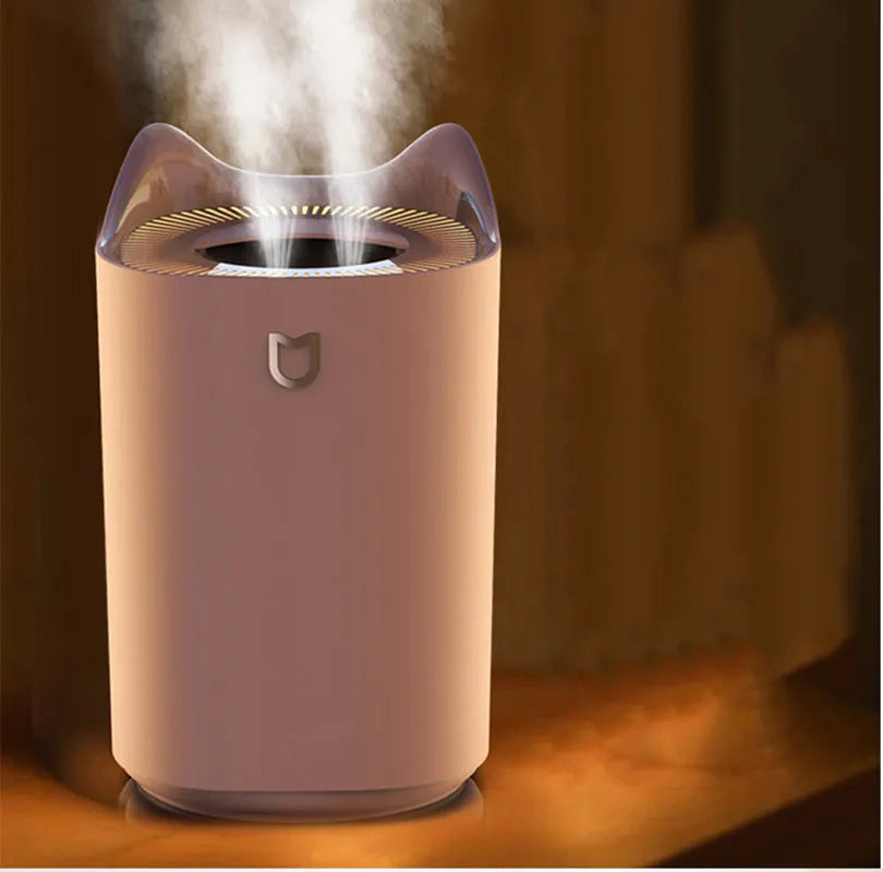 USB-powered double spray humidifier with large water tank in coral pink or white colour.