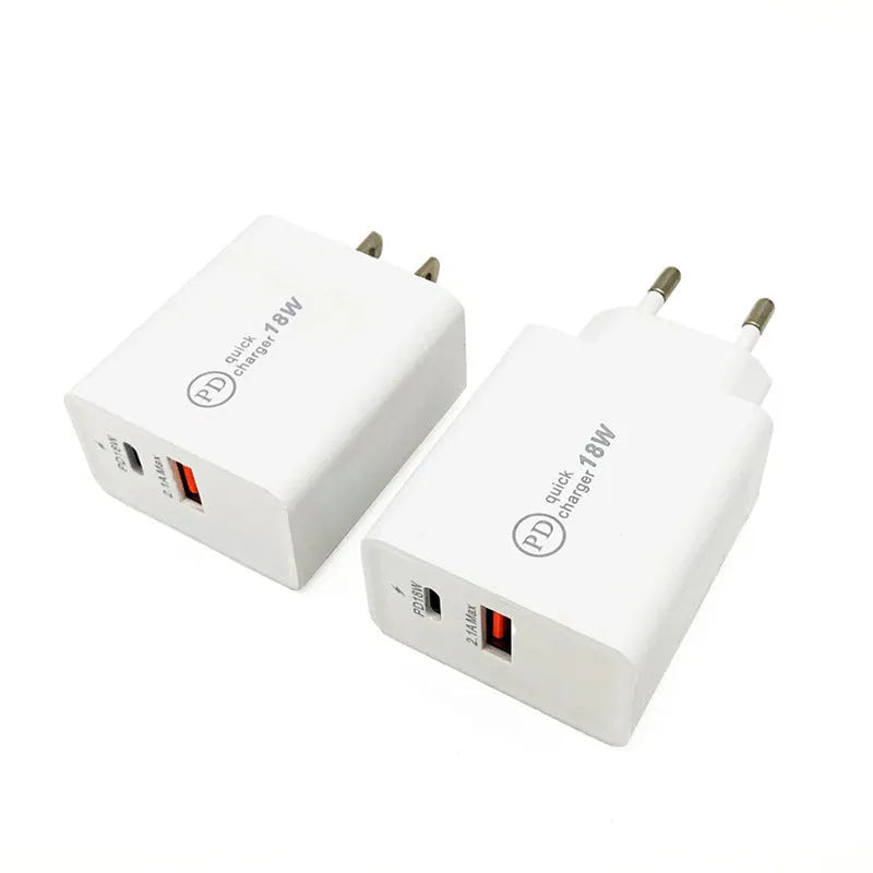 White 18W USB-C fast charger with bare metal casing and US plug on a wooden surface