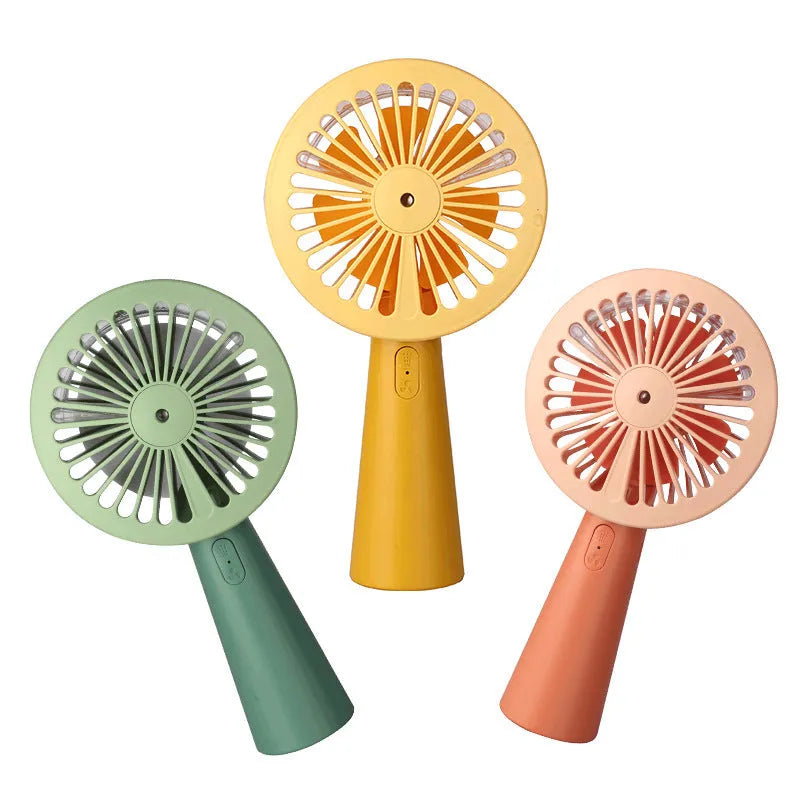 Handheld mini USB fan with nano spray in green, pink, and yellow, plastic construction, 170x100x35mm