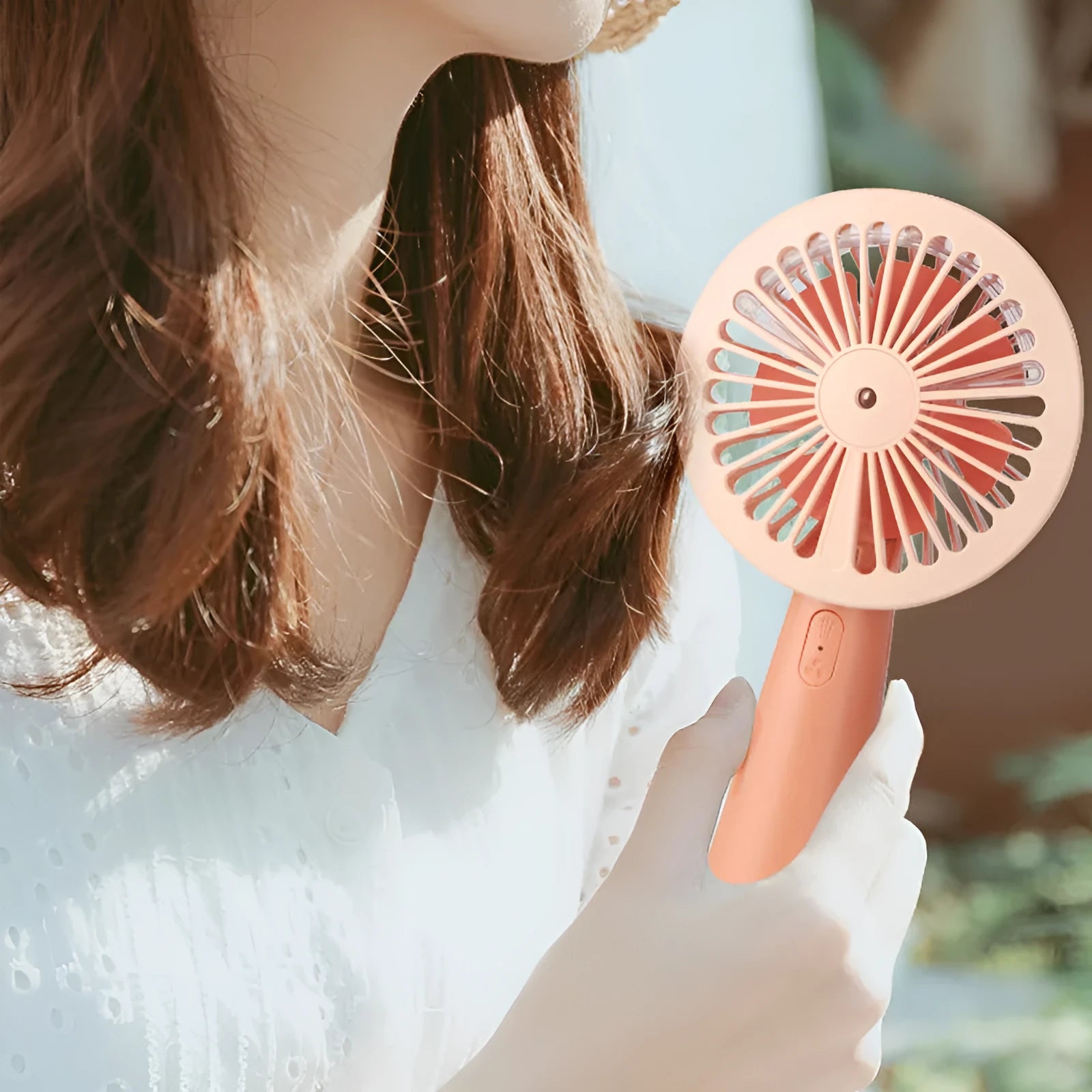 Handheld mini USB fan with nano spray in green, pink, and yellow, plastic construction, 170x100x35mm