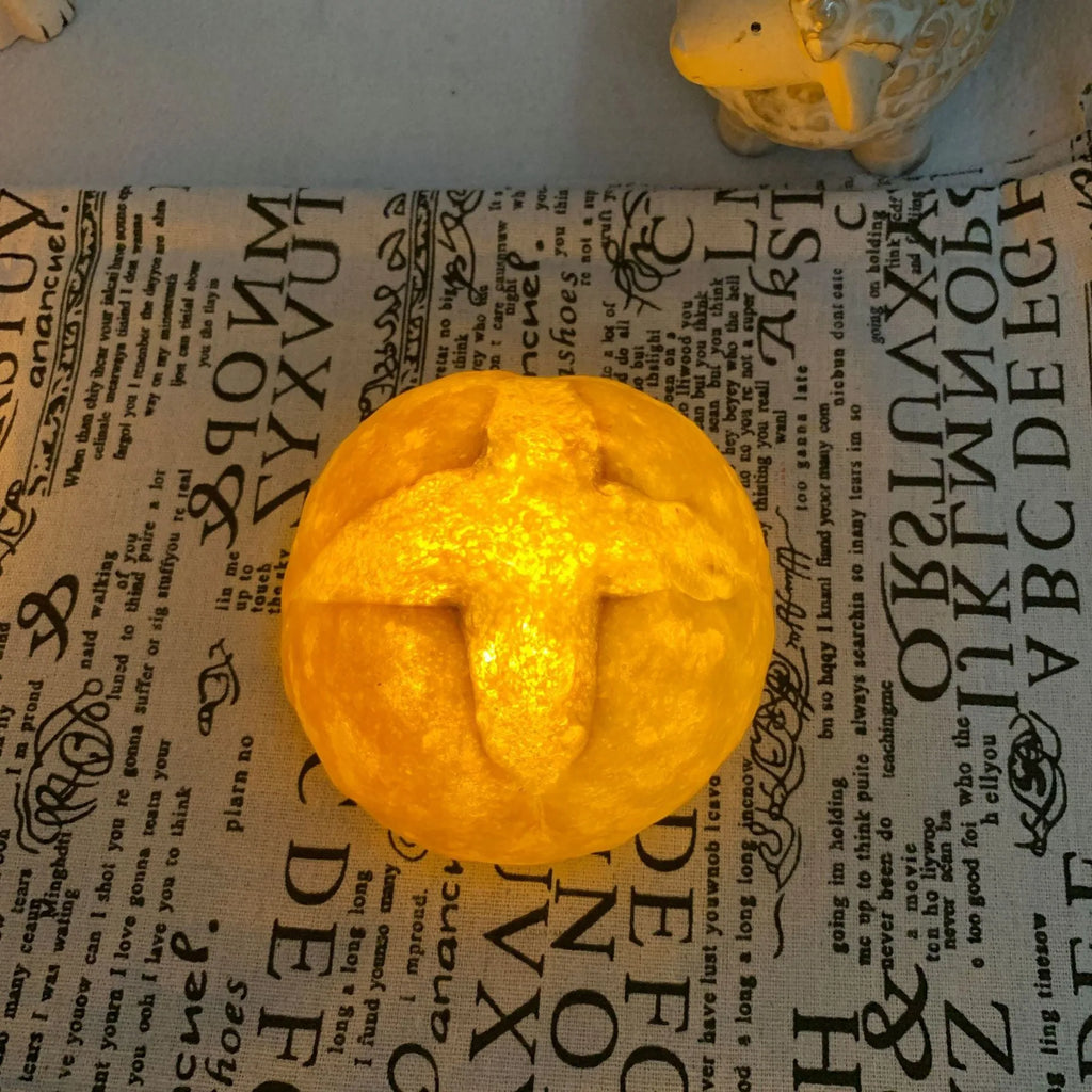 Simulation croissant-shaped LED night light on a table