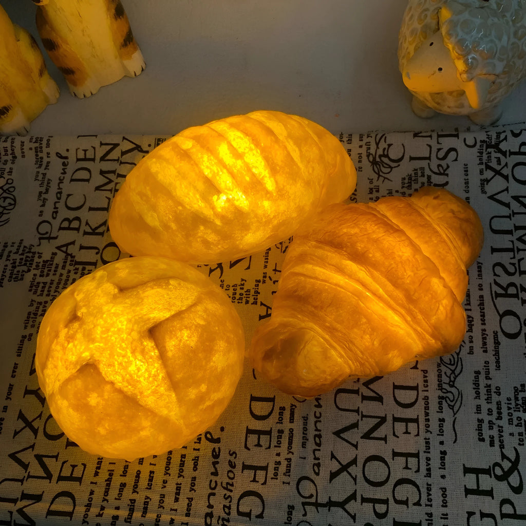 Simulation croissant-shaped LED night light on a table