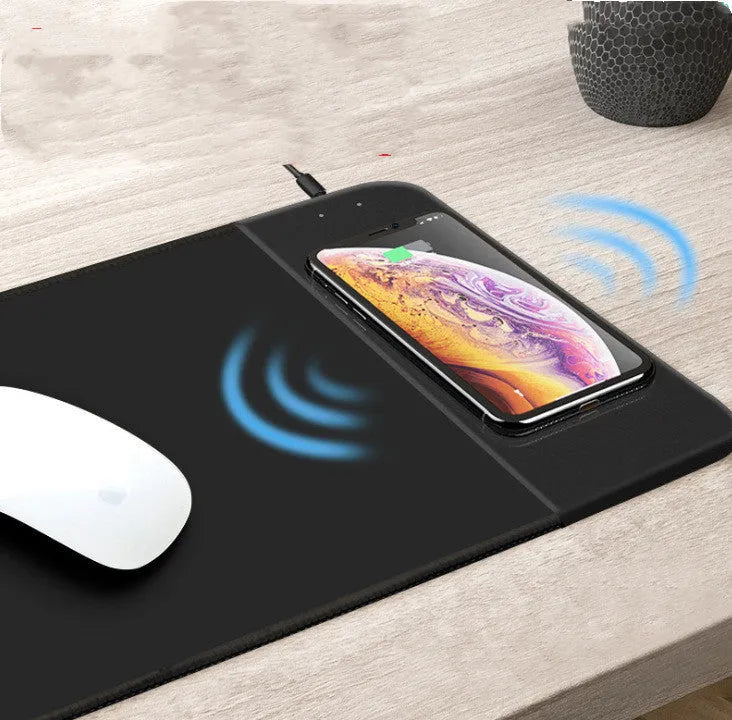 Cartoon dot print wireless charging mouse pad with RGB lighting on a desk
