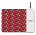 Cartoon dot print wireless charging mouse pad with RGB lighting on a desk