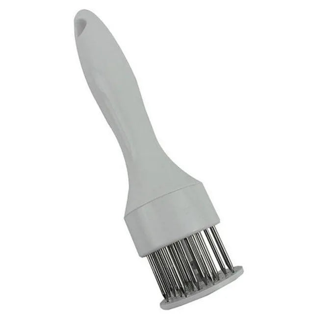 Pine meat needle tenderiser tool for steak with white handle and metal needles, shown on a kitchen surface