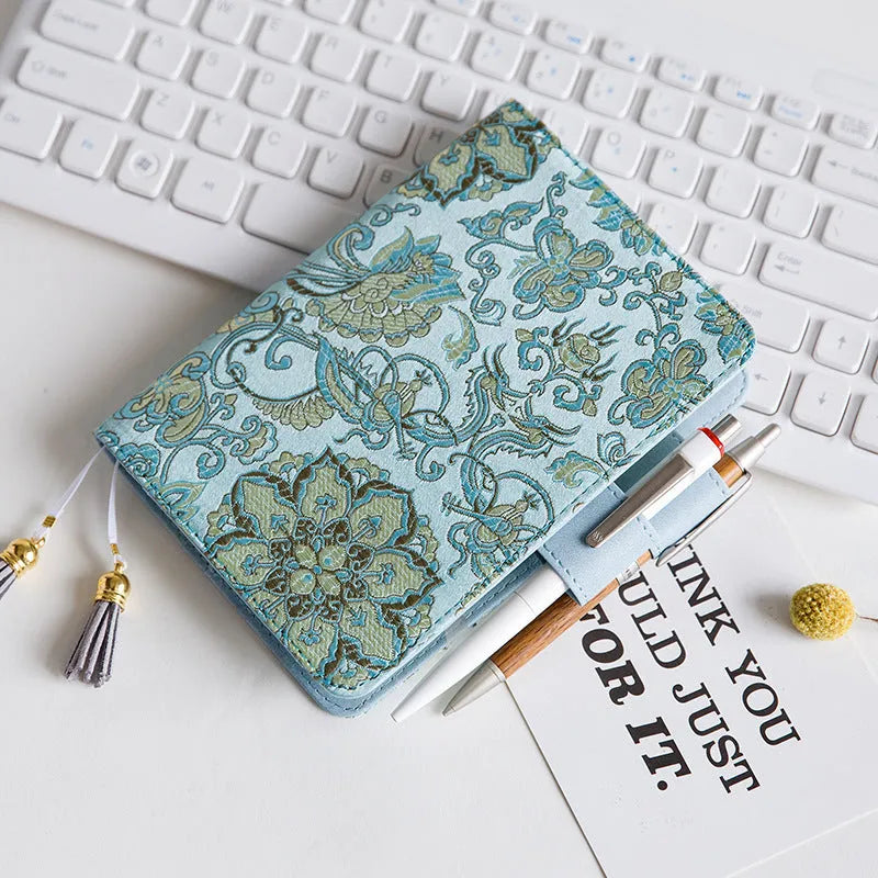 Fabric notebook with Flying Blue Flowers design showing A5 and A6 size options