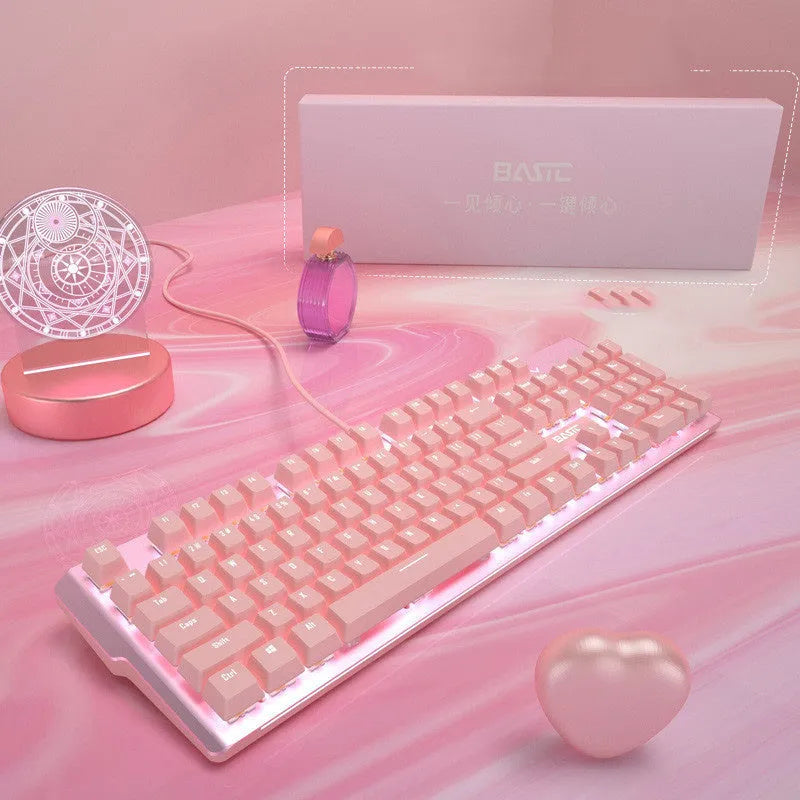 Pink mechanical keyboard and wired gaming mouse set on a desk