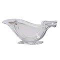 Transparent acrylic bird-shaped manual juicer for lemon slices on a kitchen counter.