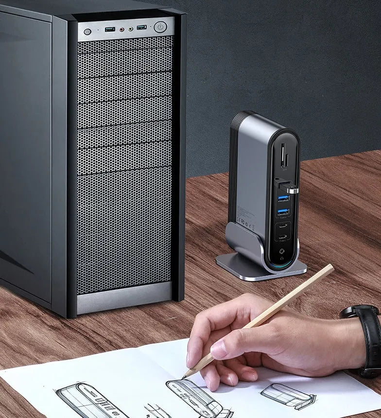 Deep space grey 16-in-1 Type-C docking station hub on a desk, showing multiple ports.