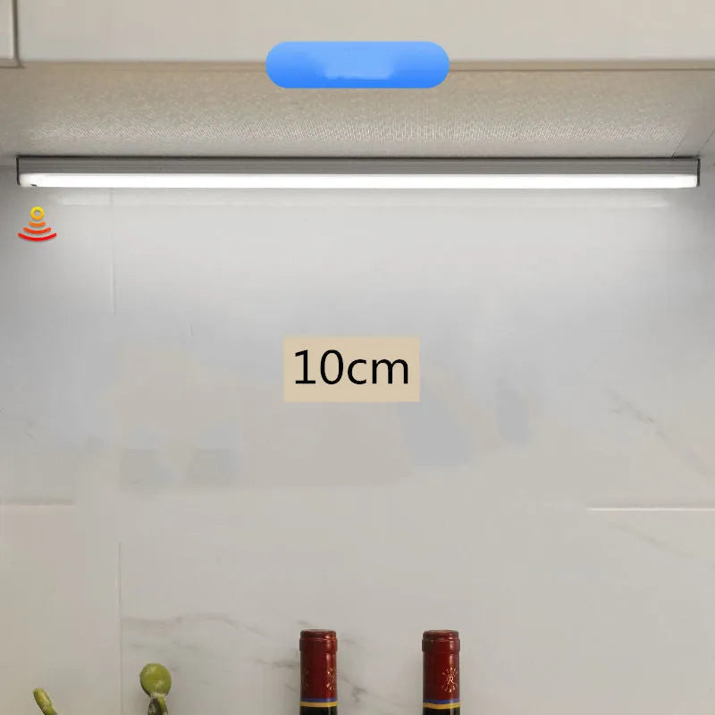 Hand-scanning induction LED cabinet lamp strip with rechargeable battery and adhesive backing