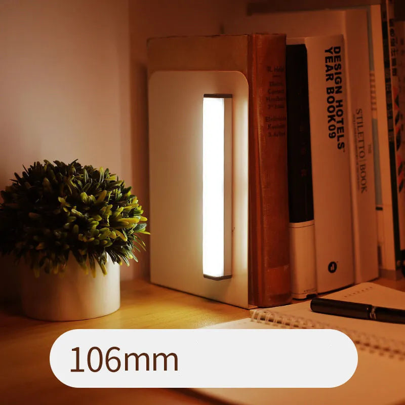 Hand-scanning induction LED cabinet lamp strip with rechargeable battery and adhesive backing