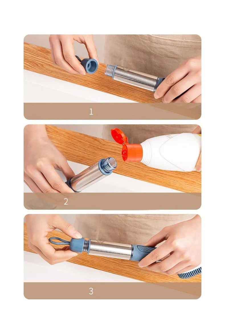 Blue long-handled kitchen dish brush with built-in soap dispenser button, sponge, and scouring block.