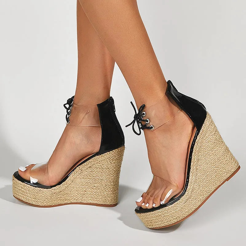 Black women's wedge sandals with hemp rope detail on a super high over 8cm platform heel and front tie closure.