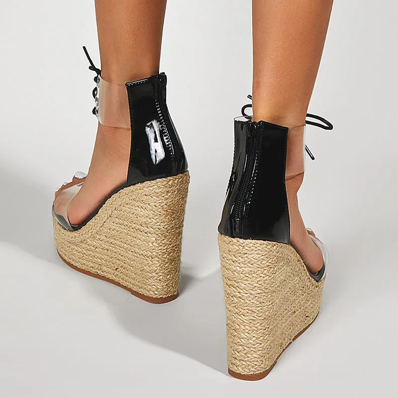 Black women's wedge sandals with hemp rope detail on a super high over 8cm platform heel and front tie closure.