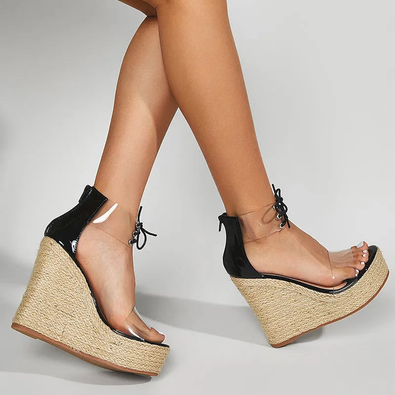 Black women's wedge sandals with hemp rope detail on a super high over 8cm platform heel and front tie closure.