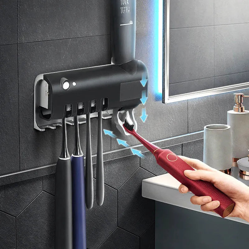 Wall-mounted UV toothbrush steriliser with automatic toothpaste dispenser in white or black