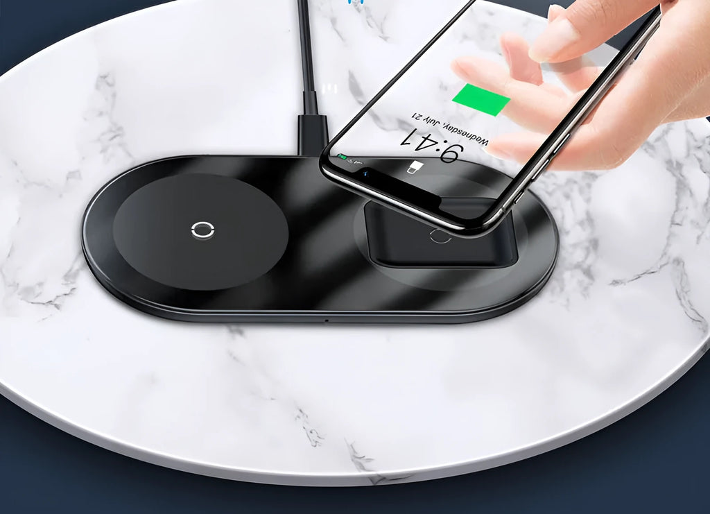 Baseus Minimalist Two-in-One Wireless Charger Pro in white charging an iPhone and AirPods case on a desk