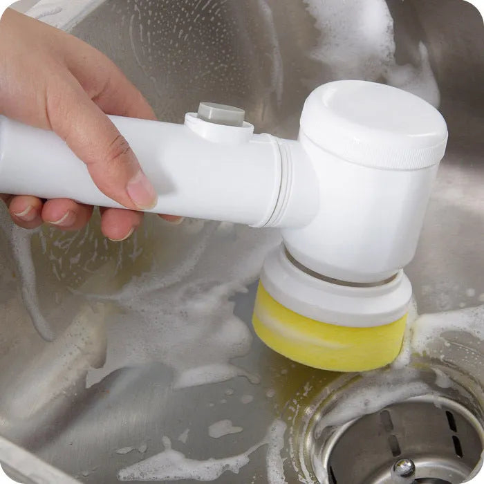 White cordless electric cleaning brush with three interchangeable nylon brush heads for bathroom and household surfaces