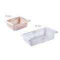 Blue telescopic plastic storage basket for refrigerator organisation with fruits and vegetables inside.