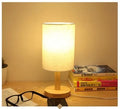 Wooden USB table LED lamp in white finish with dimmer switch, 14x14x33 cm, on a bedside table