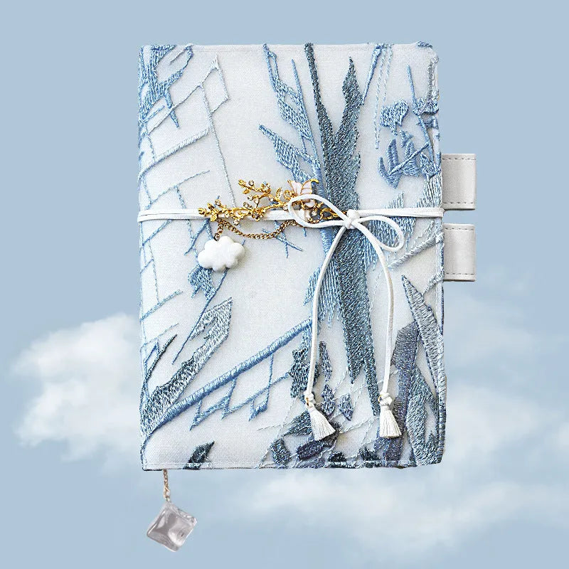 Glacier embroidery design fabric notebook in A6 and A5 sizes with grid pages.