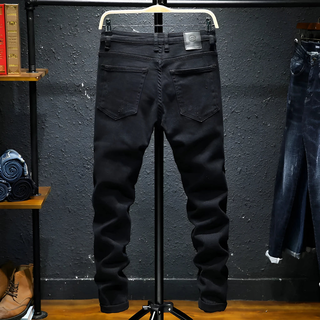 Men's black ripped stretch jeans straight leg casual denim with distressed details front view