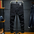 Men's black ripped stretch jeans straight leg casual denim with distressed details front view
