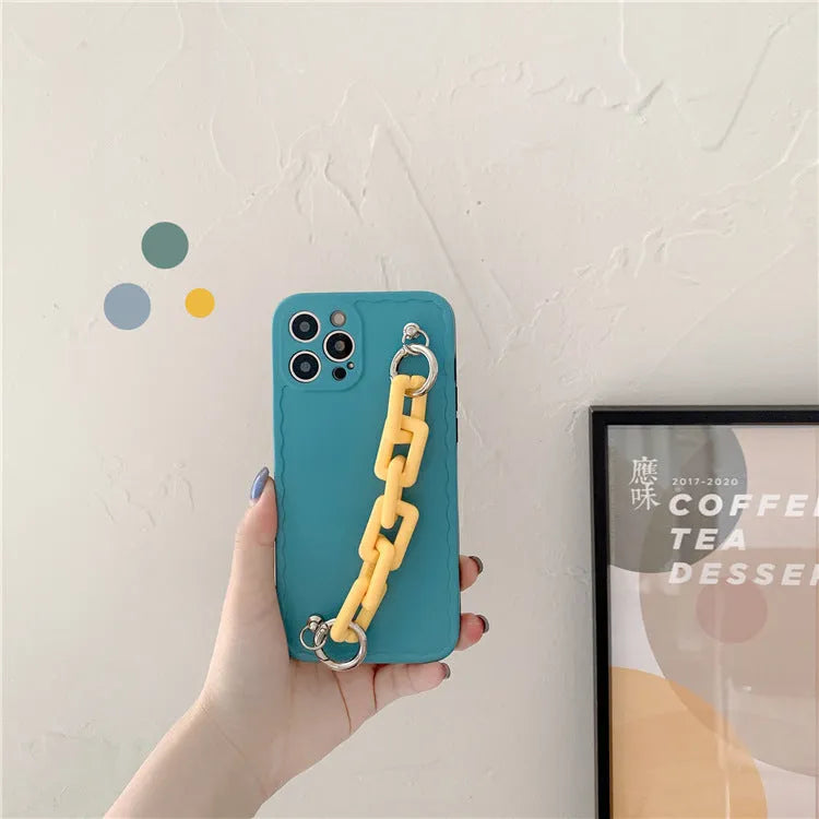 Huawei mobile phone case with rear photo frame and attached coloured chain bracelet in pink and light blue.