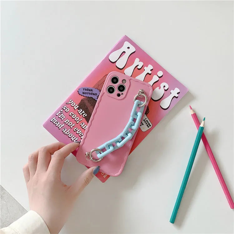 Huawei mobile phone case with rear photo frame and attached coloured chain bracelet in pink and light blue.