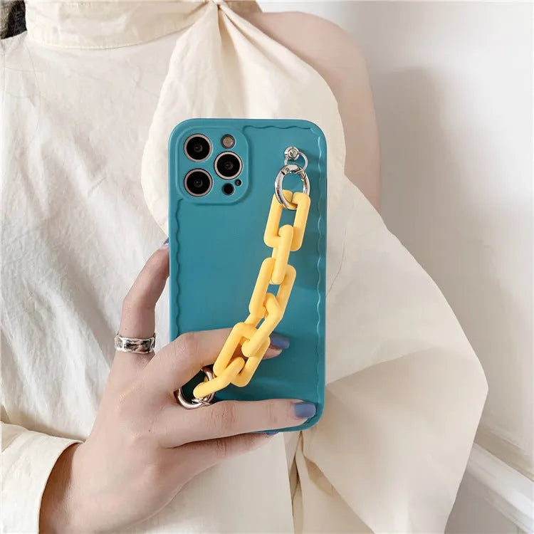 Huawei mobile phone case with rear photo frame and attached coloured chain bracelet in pink and light blue.