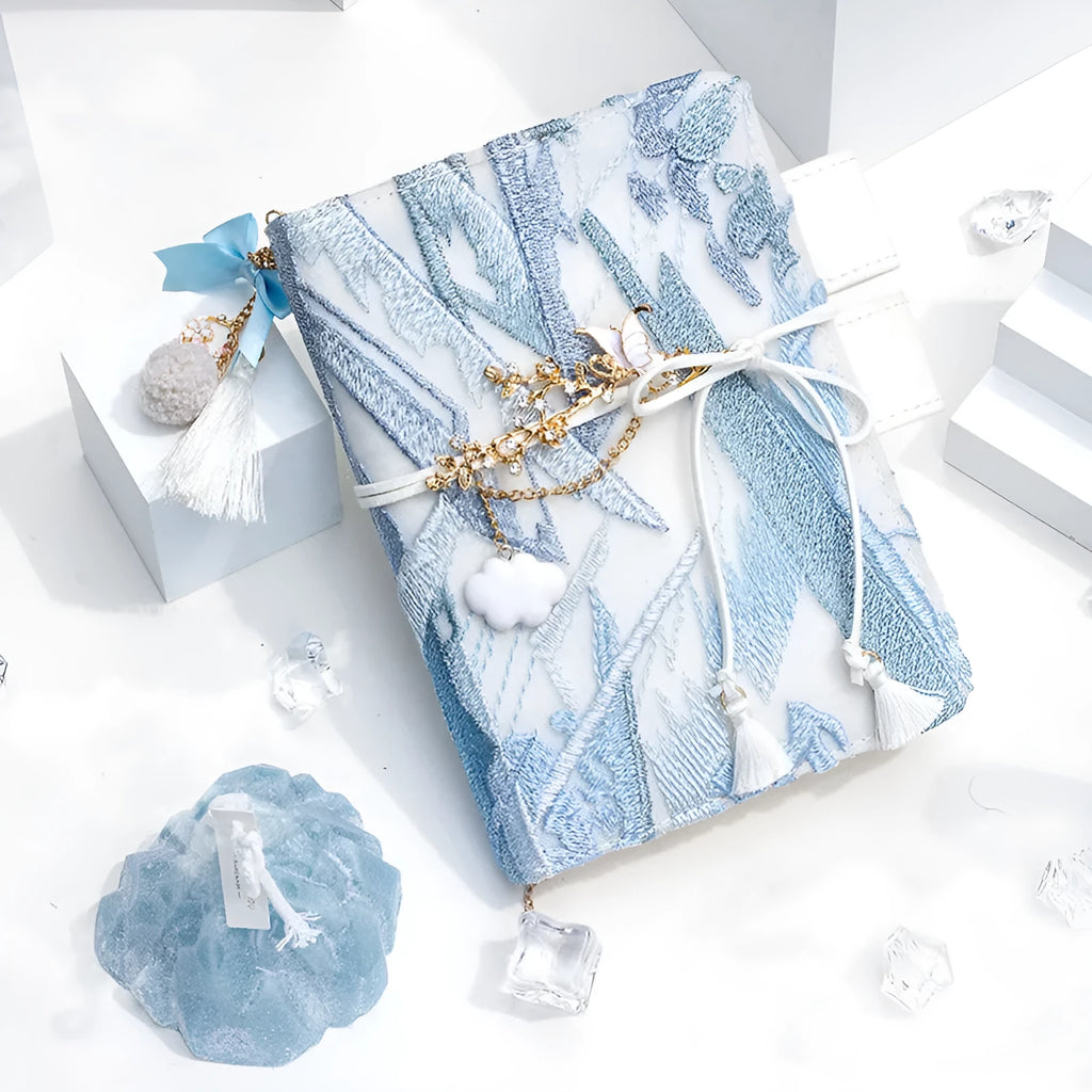 Glacier embroidery design fabric notebook in A6 and A5 sizes with grid pages.