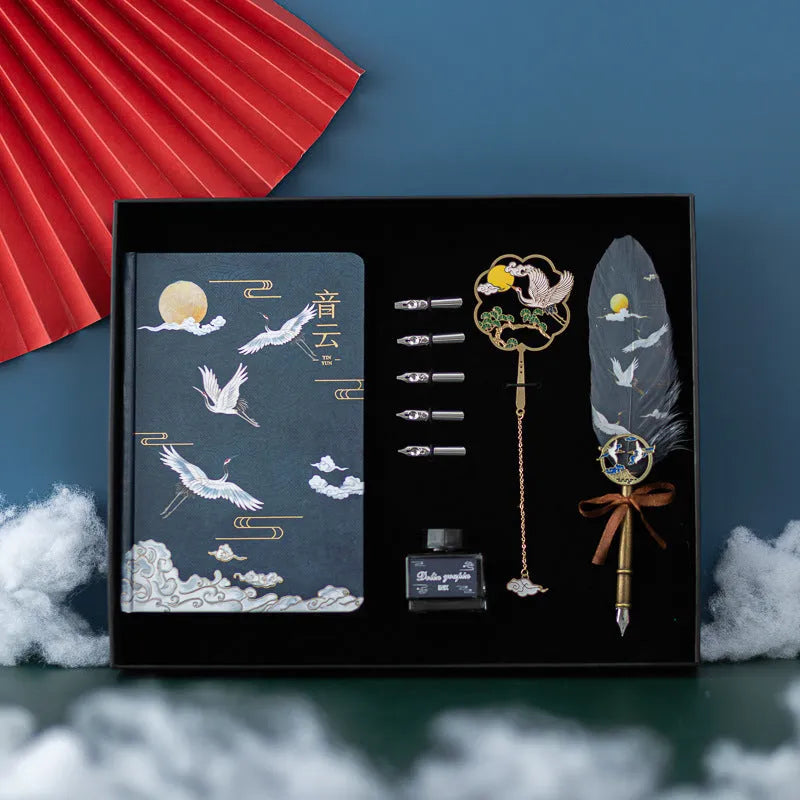 Traditional Chinese feather pen with metal shell and colourful feathers next to a Jianhegui notebook and pen sheath.