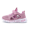 Kids pink cartoon mesh sneakers with Velcro strap on a white background.