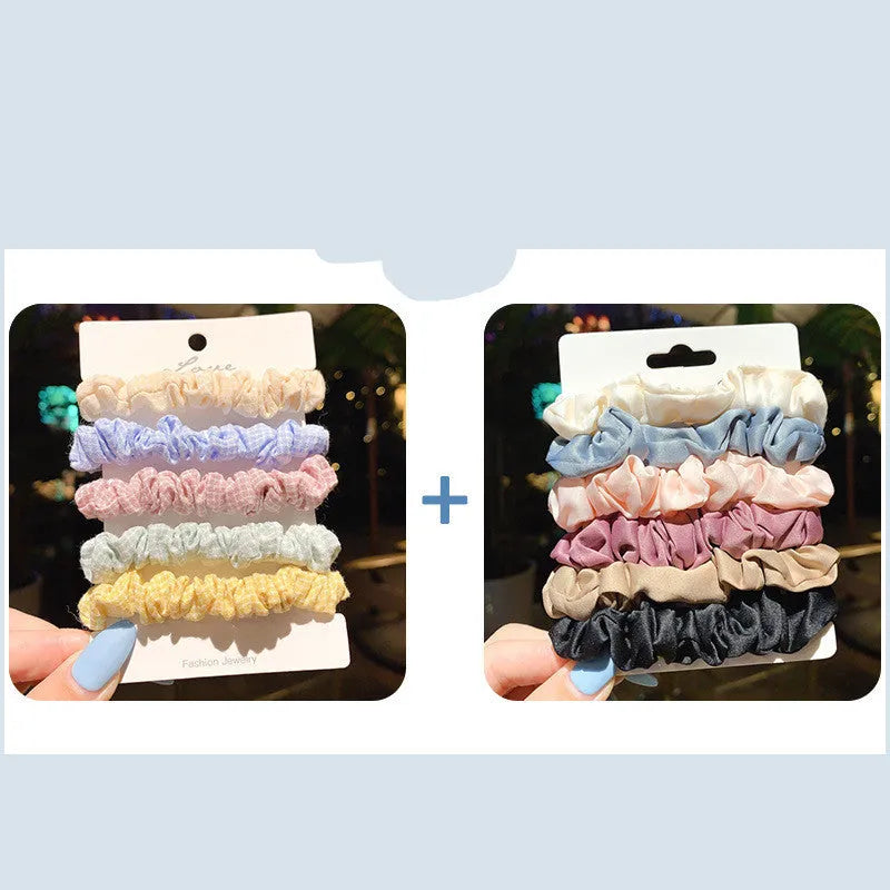 Assortment of children's hair rings and hair ropes in autumn colours and macaron pastels.