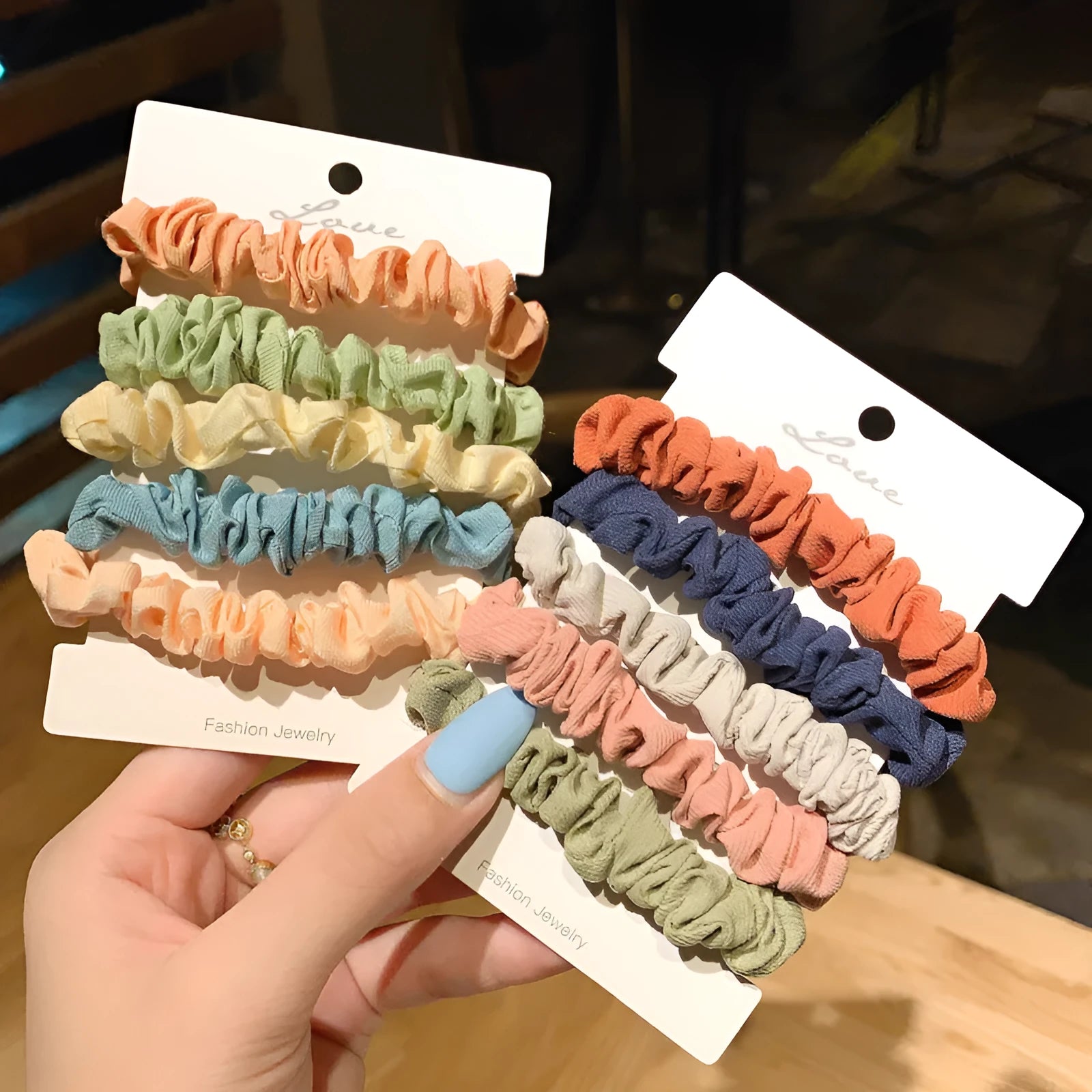 Assortment of children's hair rings and hair ropes in autumn colours and macaron pastels.
