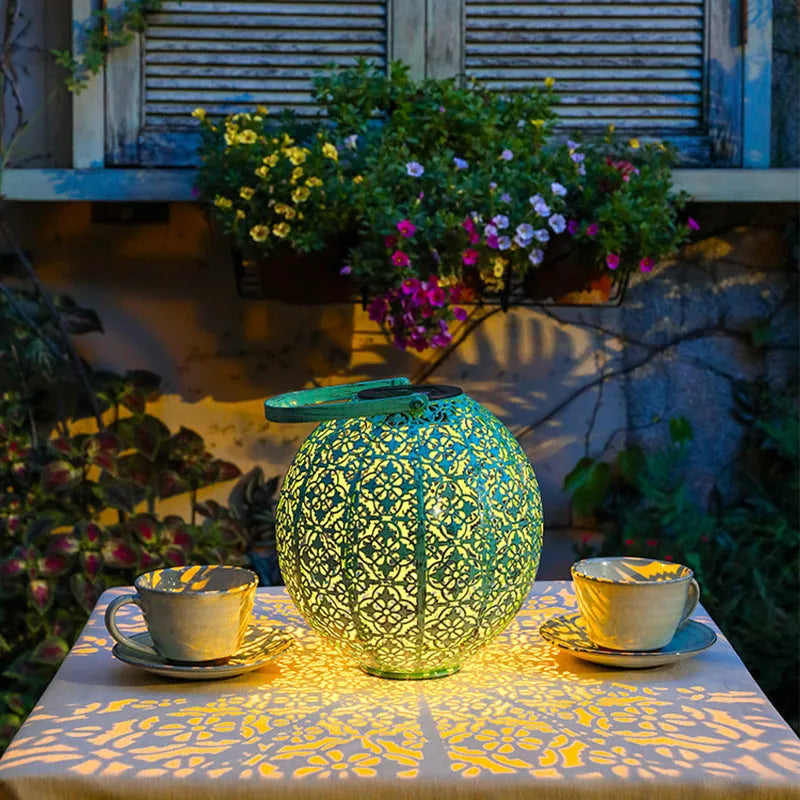 Outdoor waterproof hollow landscape LED lamp in a garden courtyard setting with decorative light pattern