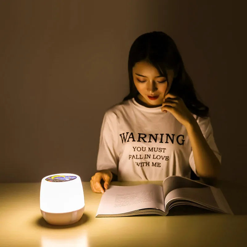 Pruixin LED projector night light projecting rotating star patterns on a bedroom ceiling.