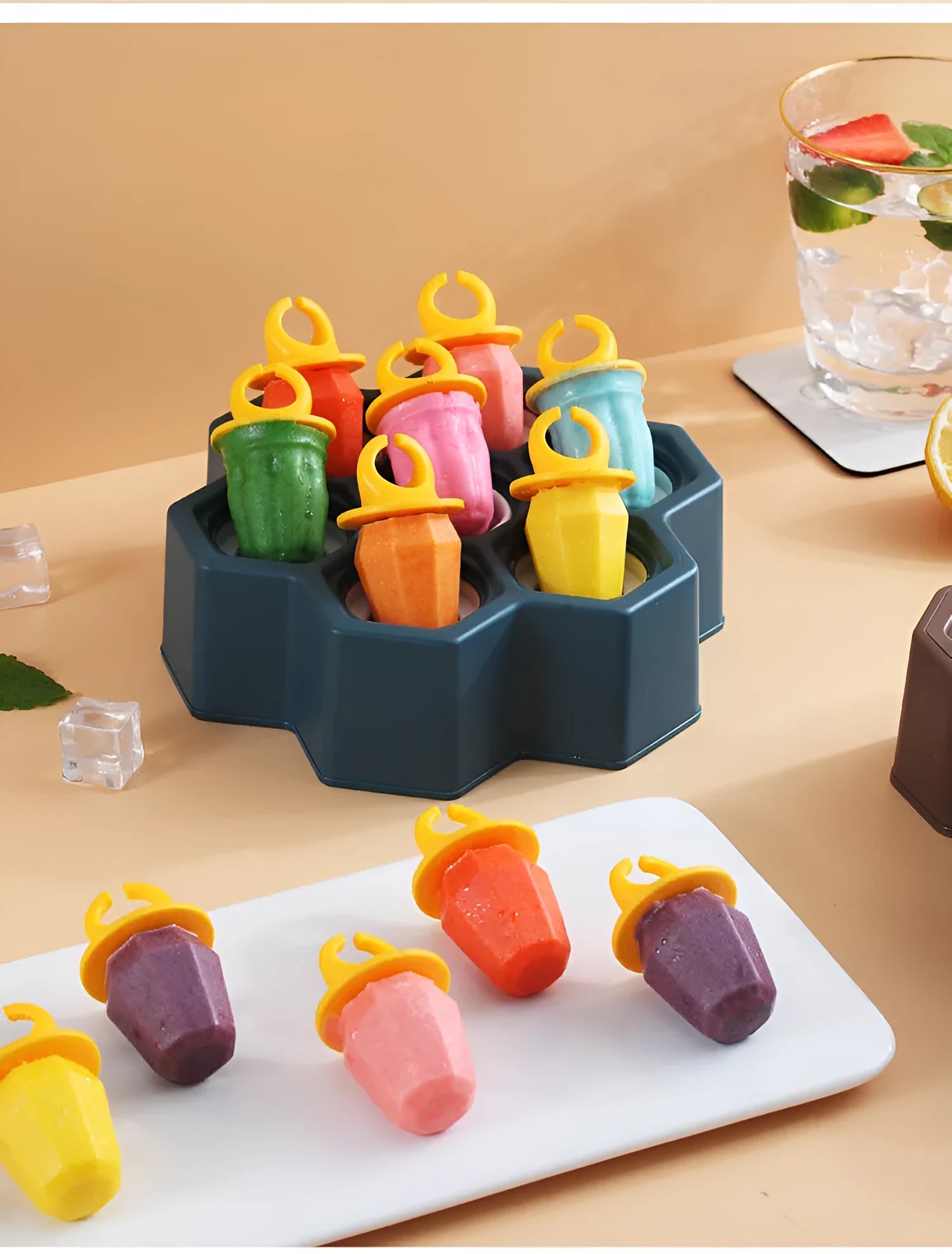 Soft plastic cartoon-style ice cream mould in brown honeycomb shape on a kitchen worktop.