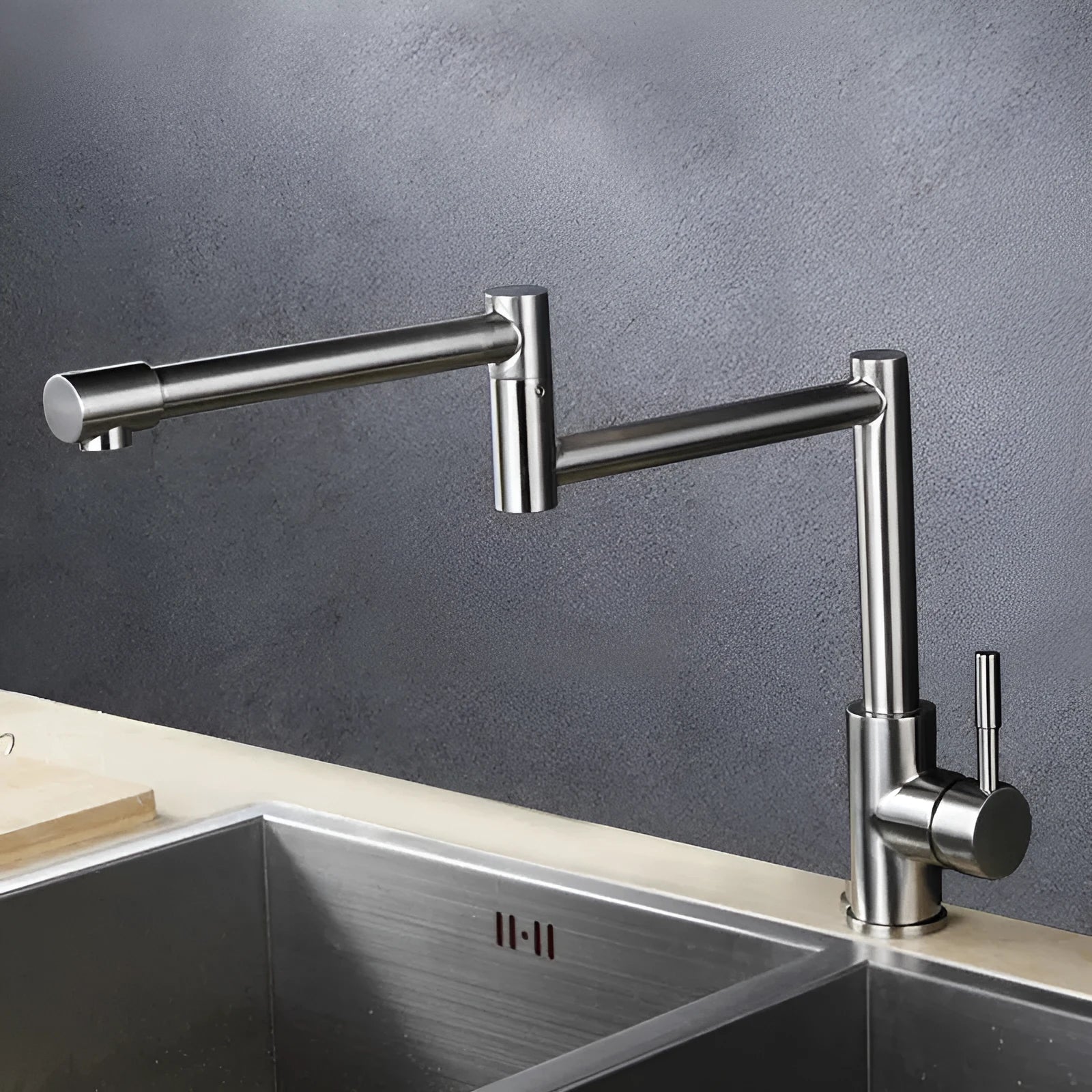 Silver stainless steel kitchen faucet with 360-degree rotation and dual hot/cold controls