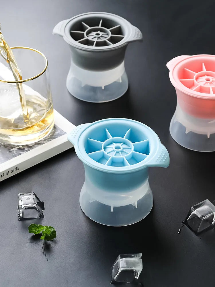 Silicone ice tray showing large hockey artefact and geometric round and pentagon ice cube moulds in assorted colours.