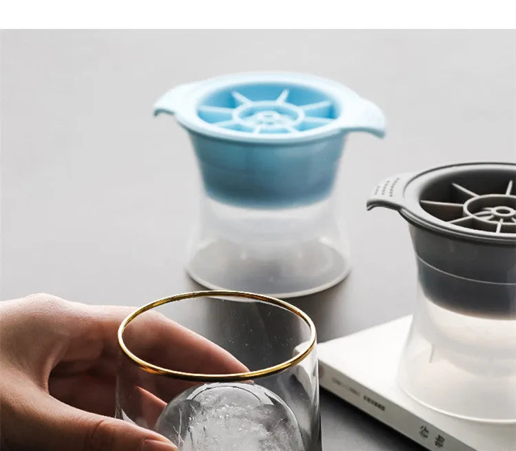 Silicone ice tray showing large hockey artefact and geometric round and pentagon ice cube moulds in assorted colours.