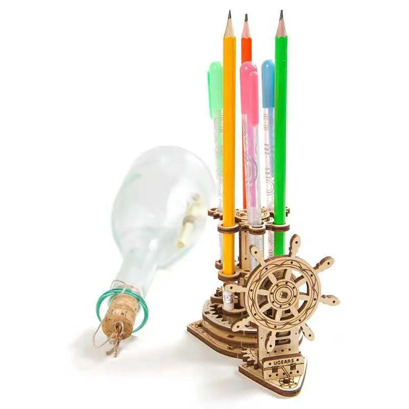 Assembled wooden desk pen holder with a steering wheel that rotates a central platform holding coloured pens.