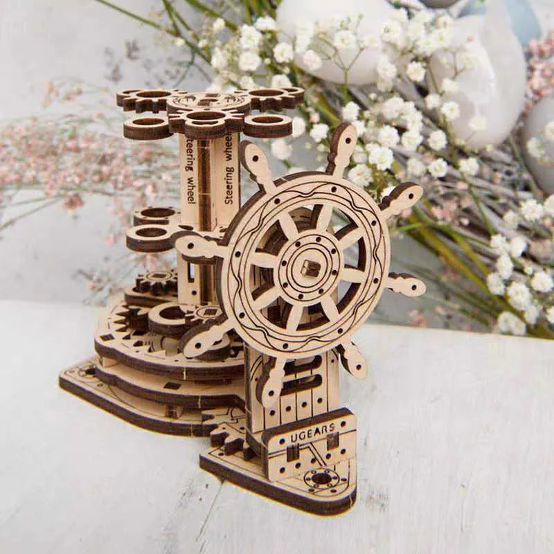 Assembled wooden desk pen holder with a steering wheel that rotates a central platform holding coloured pens.