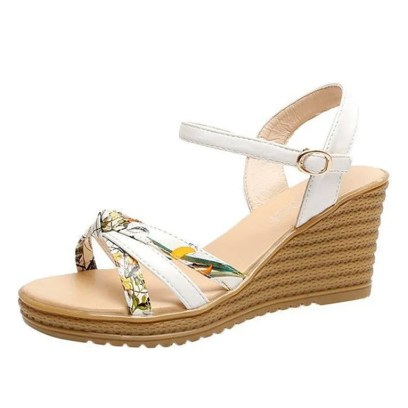Pink women's wedge sandals with peep-toe, thick heel, and a single buckle fastening on a white background.